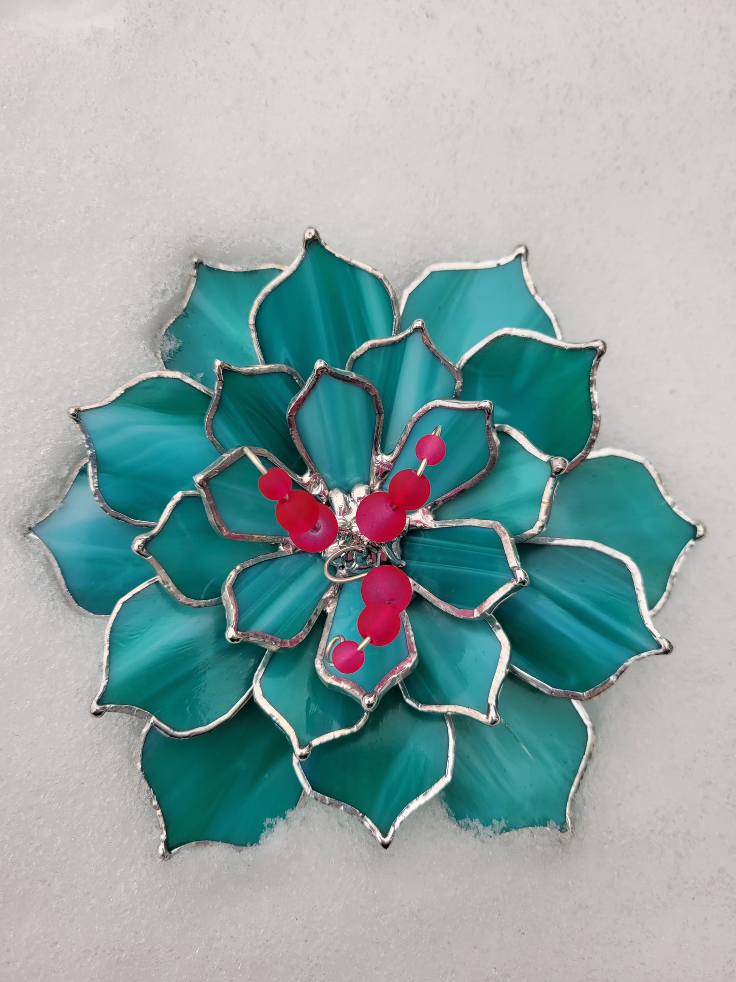 Teal stained glass flower