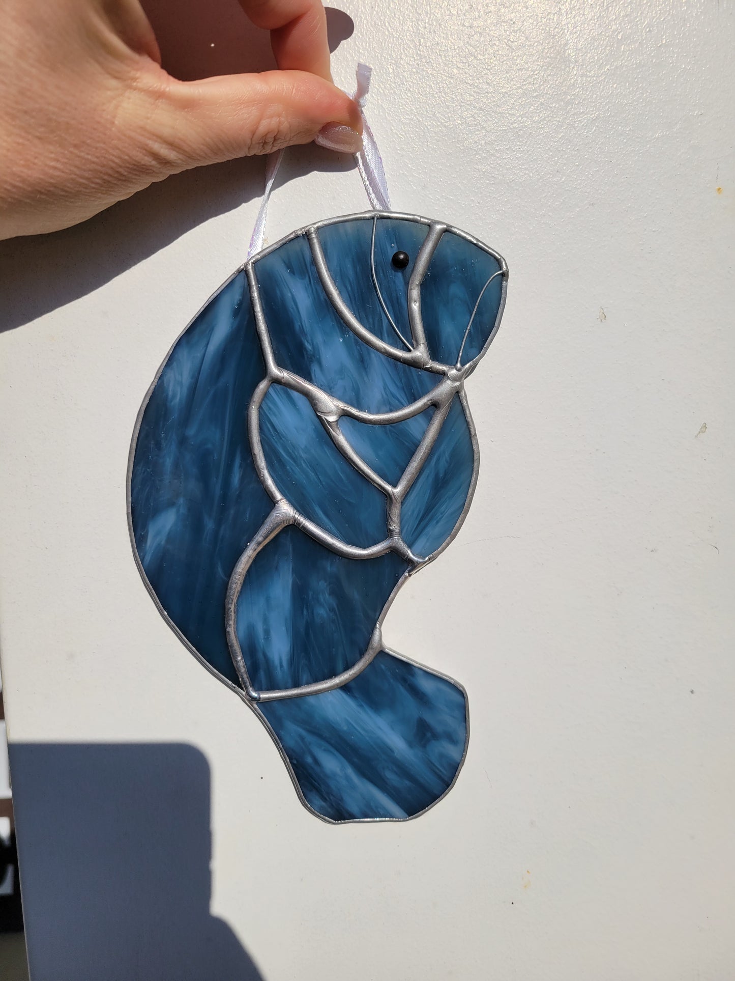 stained glass manatee