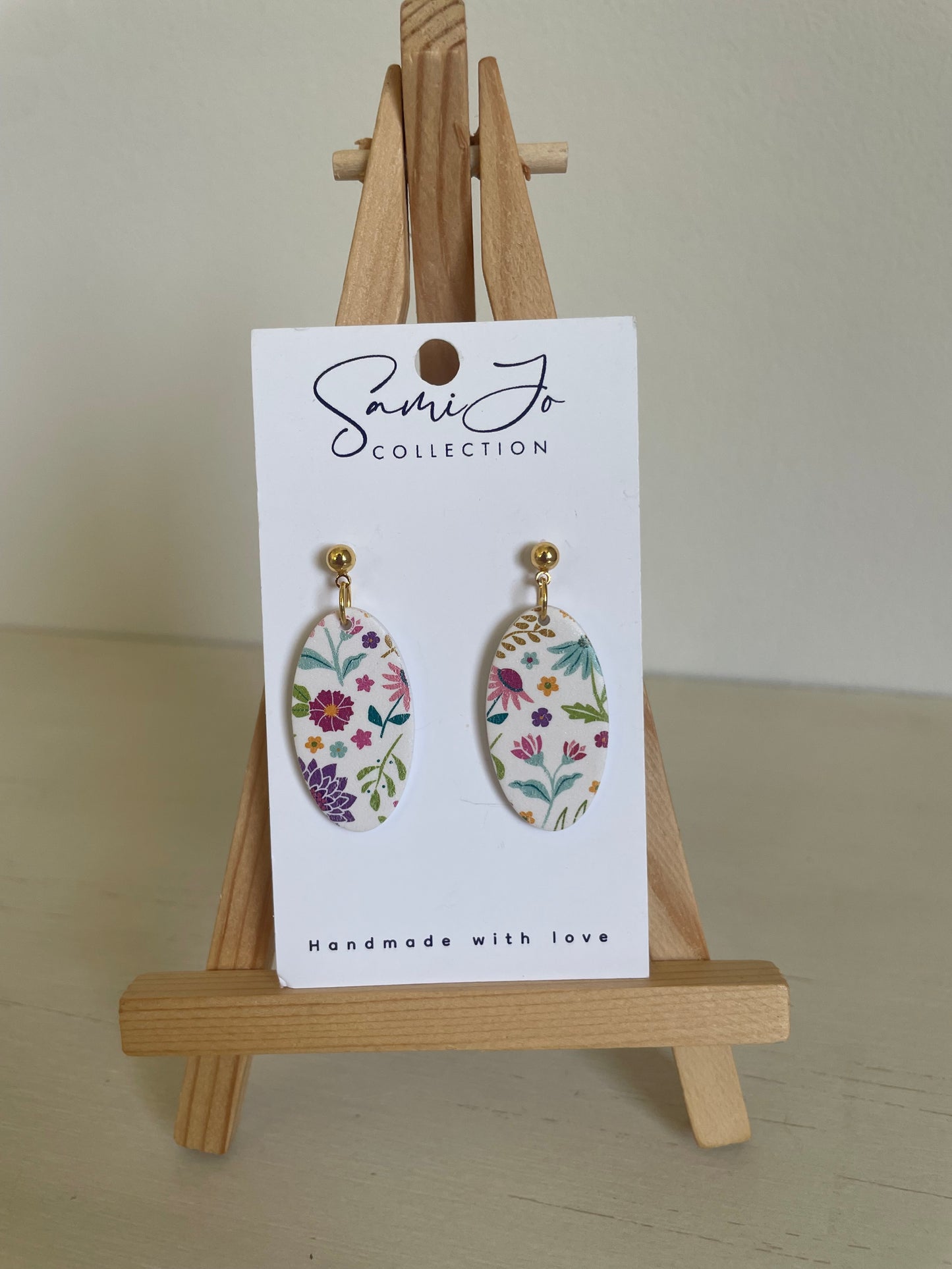 Floral oval dangles