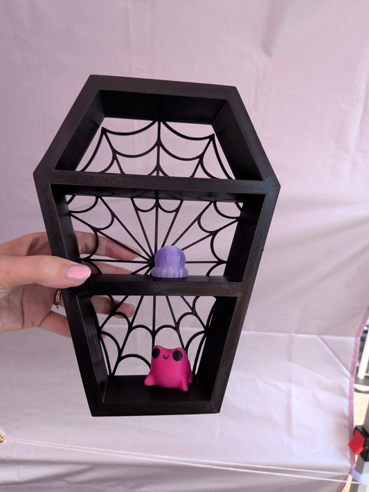 Spider web coffin shelf