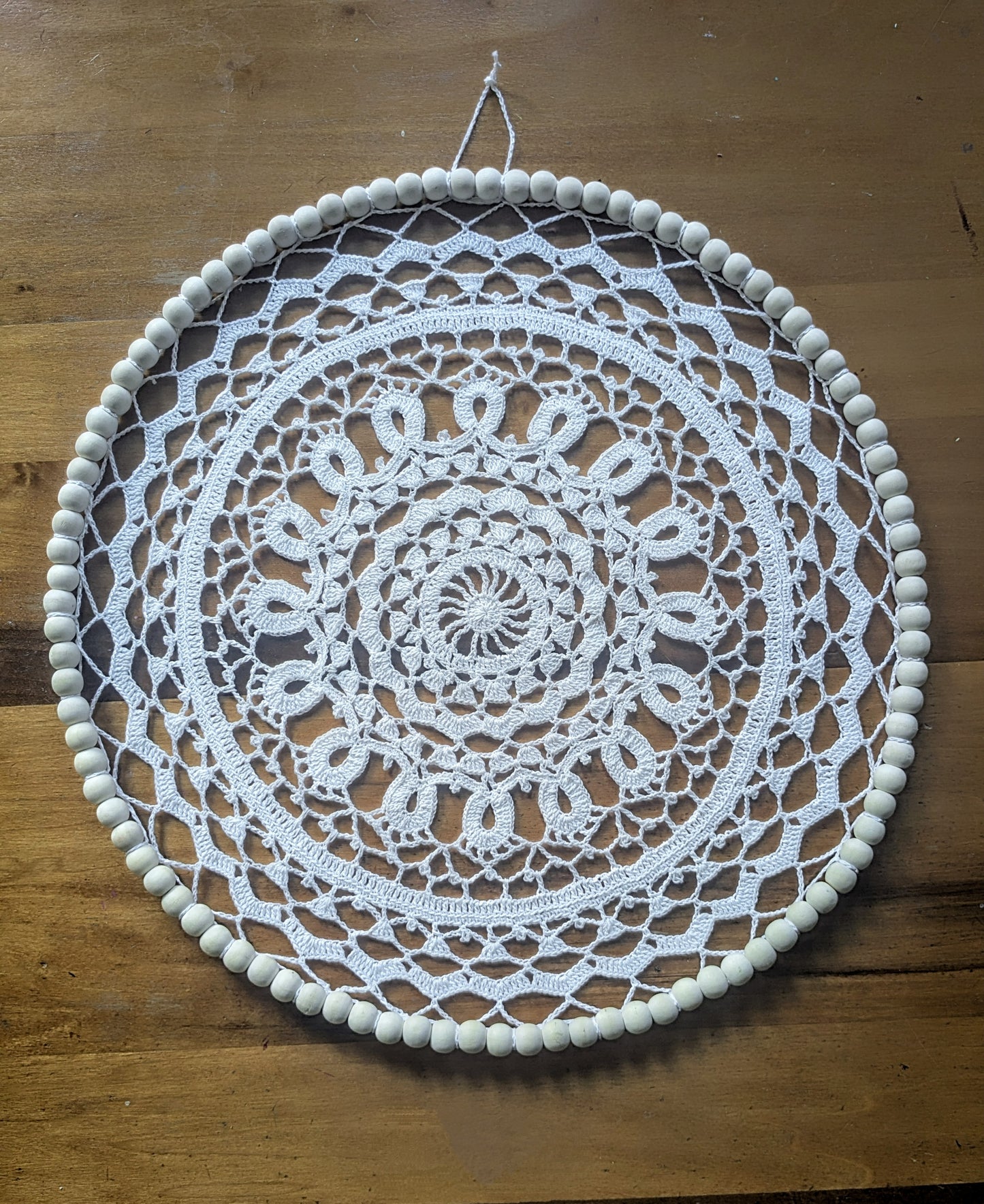 Crochet mandala with beaded wire frame