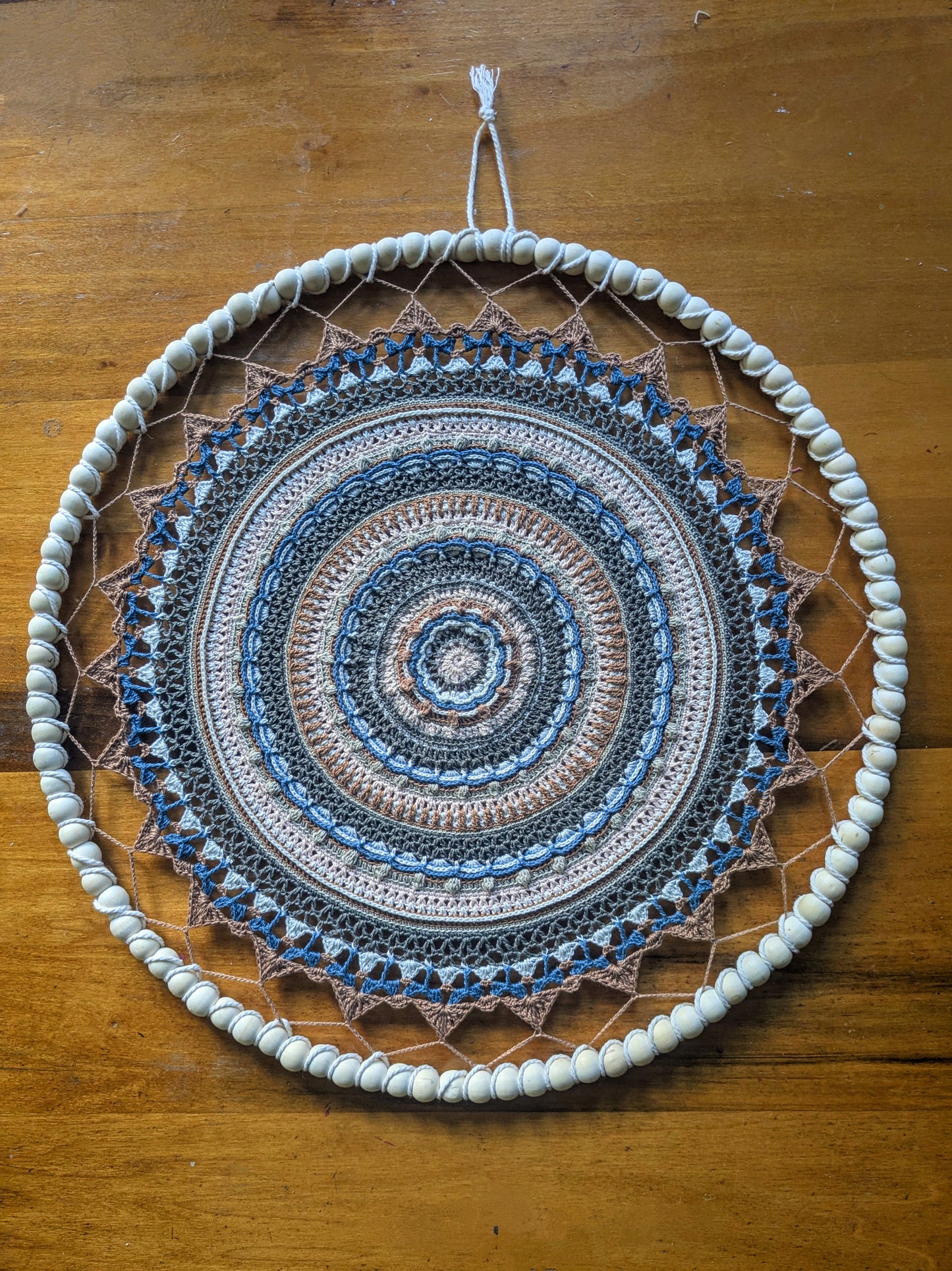 Crochet mandala with beaded wire frame